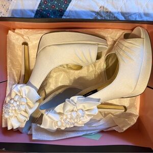 Elegant White Peep-Toe Heels with Floral Accent. Brand is Nina. 4 inch heel.